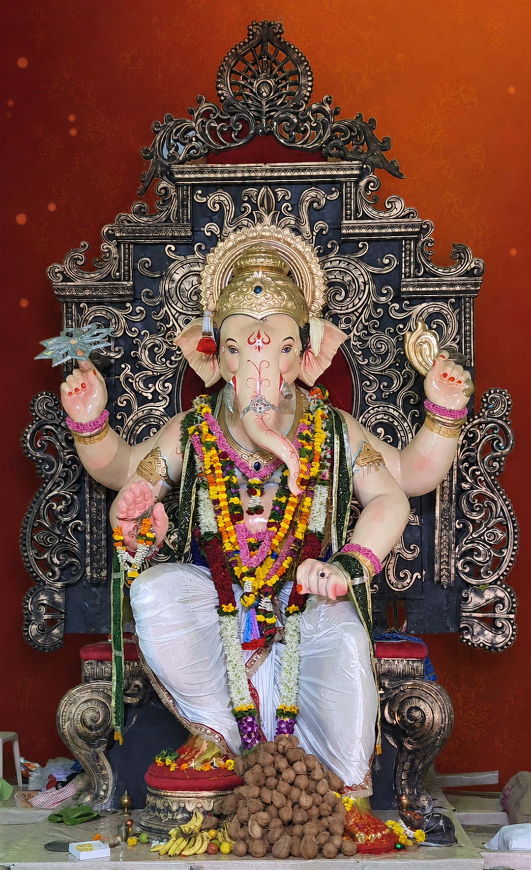 Kamathipuracha Maharaja seated on an ornate throne